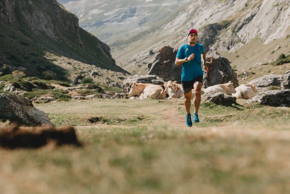 Man running in long sleeve and vest