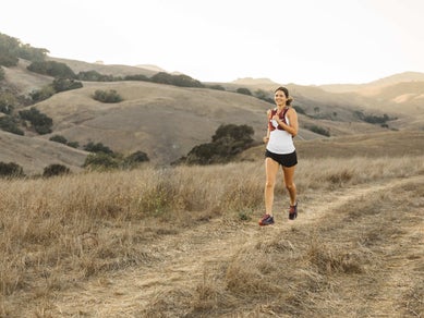 girl running in basham vest